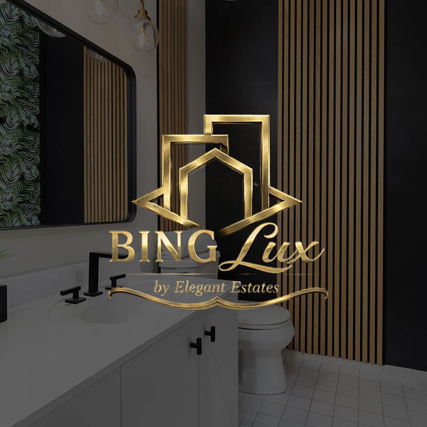 A bathroom with a white cabinet, black and wallpaper accent wall